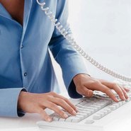 A woman types on a keyboard.