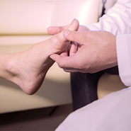 A doctor inspects a case of Hallux Valgus.